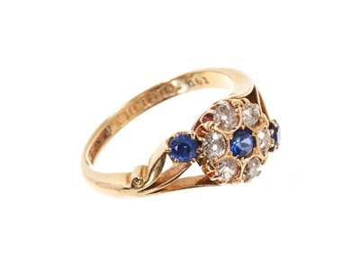 Lot 636 - Sapphire and diamond cluster ring