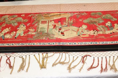 Lot 3055 - Chinese embroidered red silk banner. Silk satin stitch with crouched outlines. Garden scene with pagodas, ducks etc.