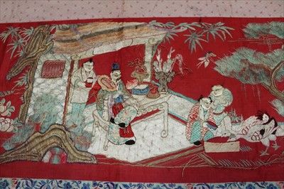 Lot 3055 - Chinese embroidered red silk banner. Silk satin stitch with crouched outlines. Garden scene with pagodas, ducks etc.