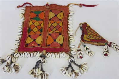 Lot 3058 - Collection of Antique Banjara textiles three pieces with cowrie shells including an embroidered cow horn cover, a square Rumal and a small hanging. Plus an embroidered belt piece with mirror-work,...