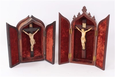 Lot 1162 - 19th century carved ivory crucifix in gothic mahogany case, together with another similar example