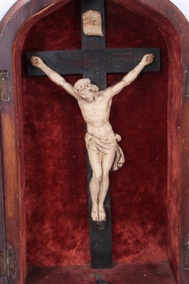 Lot 1162 - 19th century carved ivory crucifix in gothic mahogany case, together with another similar example