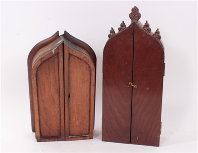 Lot 1162 - 19th century carved ivory crucifix in gothic mahogany case, together with another similar example