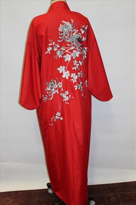 Lot 3061 - Japanese red kimono with chrysanthemum embroidery. Also a pink brocade kimono jacket and a blue silk brocade robe.