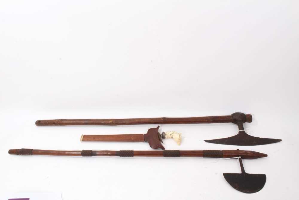 Lot 713 - two African throwing axes and Kris