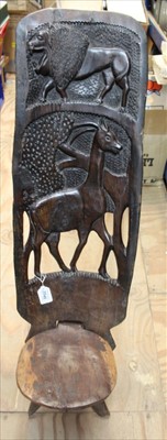 Lot 3546 - Old African carved hardwood chair with lion and antelope decoration