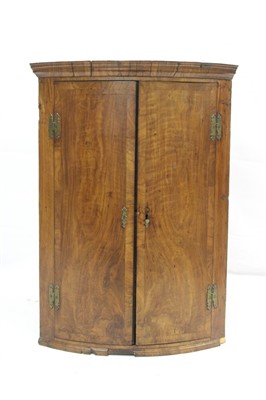 Lot 1673 - George I red walnut crossbanded hanging corner cabinet