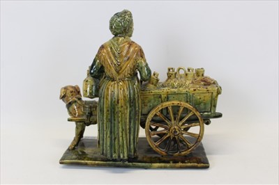 Lot 2034 - Unusual large pottery figure group of an elderly lady with a dog pulling a cart, approx 26cm in length