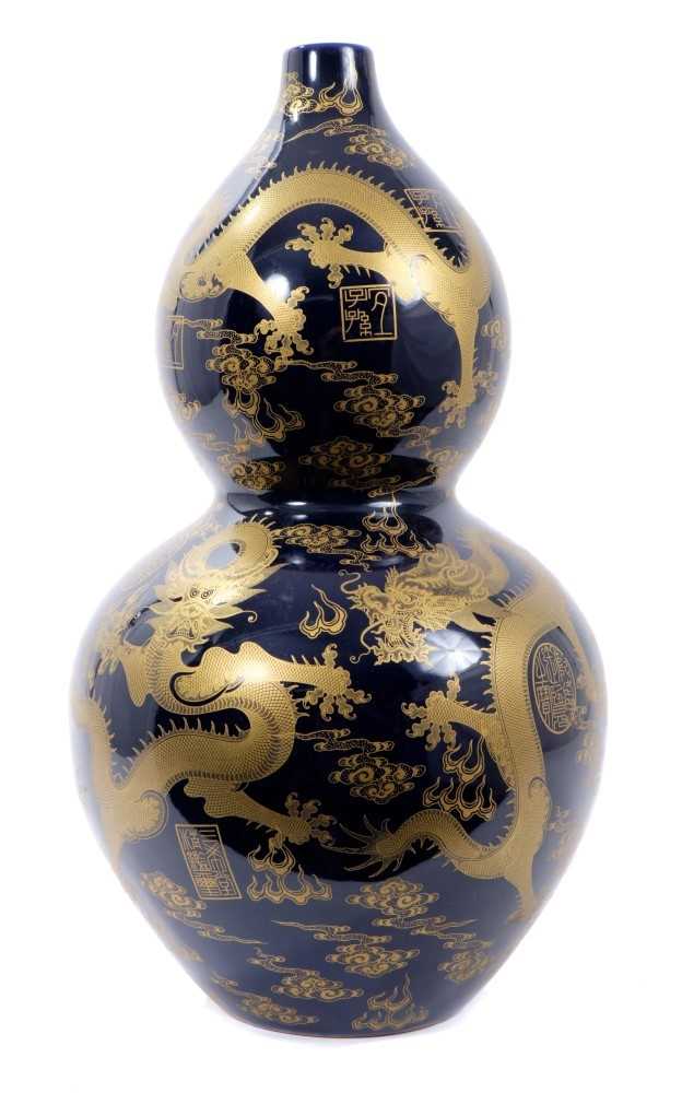 Lot 324 - Blue and gold vase