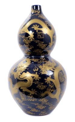 Lot 324 - Blue and gold vase