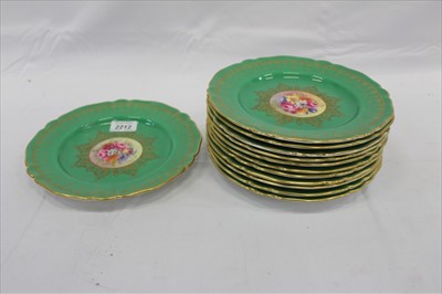 Lot 2212 - Twelve Royal Worcester cabinet plates with central hand painted floral decoration signed S. Stanley with green and gilt borders. (12)