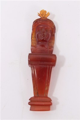 Lot 1140 - Antique amber carving of an Egyptian figure