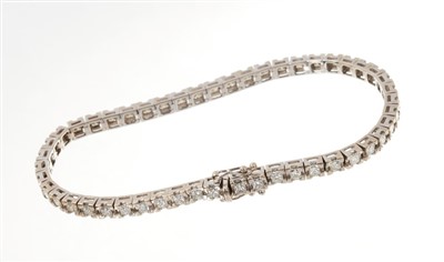 Lot 624 - Diamond tennis bracelet with a line of princess cut diamonds in 18ct white gold setting