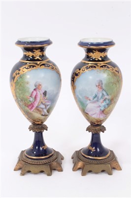 Lot 316 - Pair of Sevres style vases with metal mounts