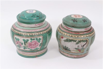 Lot 371 - Two Chinese polychrome enameled yixing pottery jars and covers