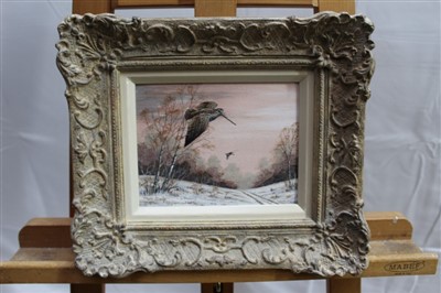 Lot 1551 - Mark Chester acrylic on canvas board - Woodcock over a snow covered track, signed, framed