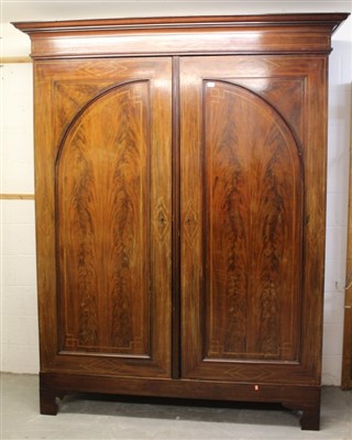 Lot 1733 - Large early 19th century mahogany and barber-pole strung armoire