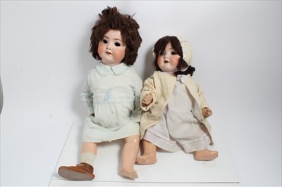 Lot 2839 - Two German Bisque head  dolls together with clothing including Heubach Koppelsdoft with wobbly tongue..