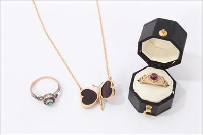 Lot 3265 - Gold 9ct tortoiseshell butterfly necklace, gold 9ct cabochon garnet ring and a dress ring (3)