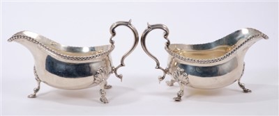 Lot 475 - Pair of George V silver sauce boats with gadrooned borders