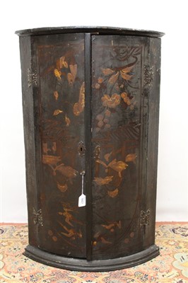 Lot 1657 - 18th century chinoiserie barrel front hanging corner cupboard with figure and floral decoration