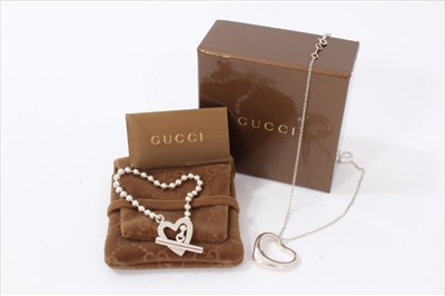 Lot 3262 - Gucci silver heart bracelet with original cloth pouch and box, together with a Tiffany & Co. silver heart pendant on chain