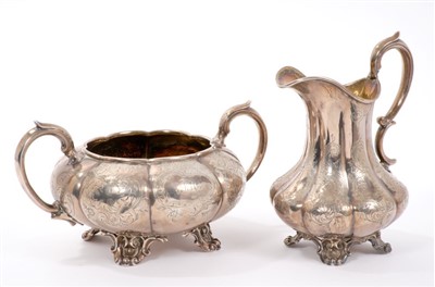 Lot 469 - Victorian silver cream jug of lobed baluster form, and matching sugar bowl.