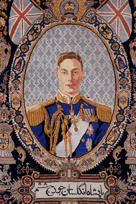 Lot 47 - Fine 1930s-1950s Persian silk pictorial rug depicting H.M. King George VI in naval uniform