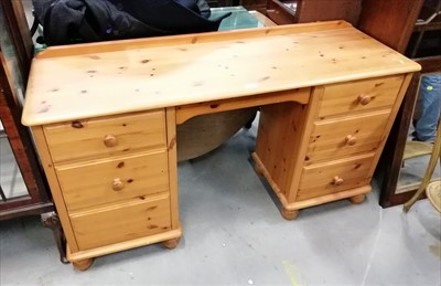 Lot 890 - Modern pine kneehole dressing chest together with an oak two tier glass top coffee table (2)