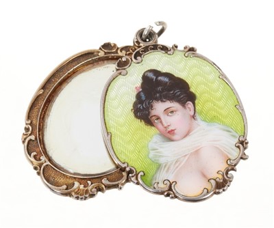 Lot 742 - Edwardian silver and enamel pendant with concealed mirror, the front with guilloche enamel portrait of a scantily clad female bust