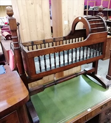 Lot 891 - Victorian mahogany rocking crib on stand with spindle turned body