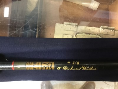 Lot 3523 - Two cased Hardy fishing rods together with another rod