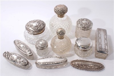 Lot 518 - Collection of ten silver mounted cut glass perfume bottles and vanity jars.