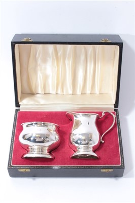 Lot 522 - Contemporary silver milk jug and sugar bowl in fitted case