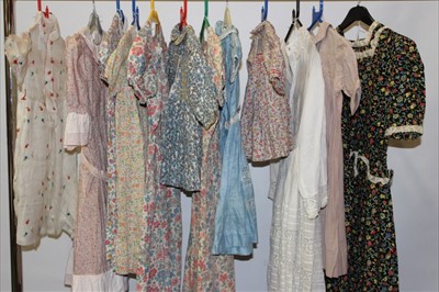 Lot 3076 - A collection of mainly 1930's - 50's girls Liberty print dresses and smocks.