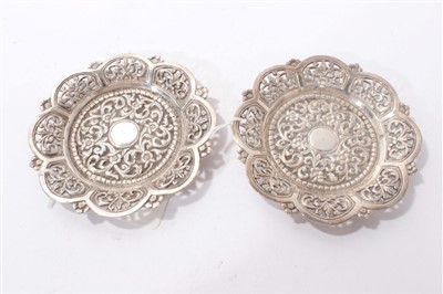 Lot 187 - Pair of late 19th/early 20th century Indian white metal dishes of flower head form.