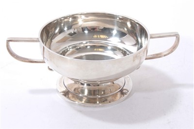 Lot 546 - Edwardian silver two handled sugar bowl with angular handles and circular pedestal foot.