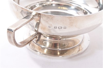 Lot 546 - Edwardian silver two handled sugar bowl with angular handles and circular pedestal foot.