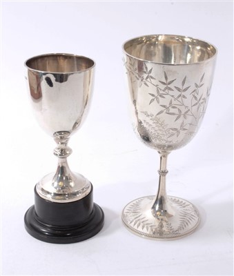 Lot 510 - Victorian silver goblet with engraved foliate decoration, together with a silver trophy.