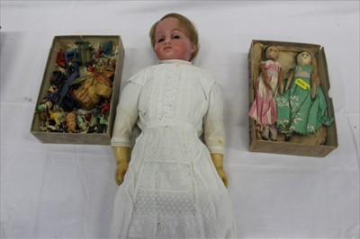 Lot 2767 - Antique Wax doll, together with two small wooden peg dolls