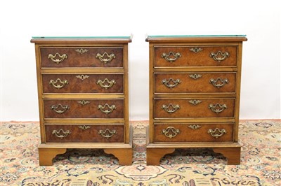 Lot 1698 - Pair of Georgian style walnut finished bedside chests of four drawers with brass handles on bracket feet