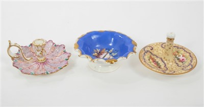 Lot 235 - Early 19th century English porcelain, to include a Minton chamberstick, painted in polychrome enamels with feathered decoration, a Copeland Garrett ring holder, and an Alcock pin dish painted with...