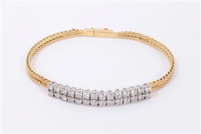 Lot 680 - 18ct gold and diamond bracelet