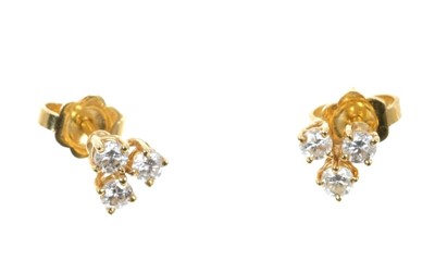 Lot 682 - Pair of diamond earrings, each with three brilliant cut diamonds