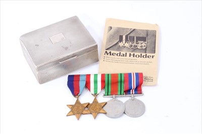 Lot 550 - Second World War medal group comprising 1939 - 1945 Star, Italy Star, Defence and War medals (mounted on bar), together with a 1920's silver cigarette box, with engine turned decoration (London 1926)