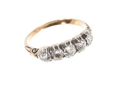 Lot 639 - Mid Victorian diamond five stone ring with five old cut diamonds in silver collet setting, carved shoulders on gold shank. Estimated total diamond weight approximately 1ct. Finger size M.