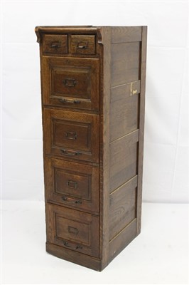 Lot 1685 - Early twentieth century oak filing cabinet with two short and four long drawers with metal handles