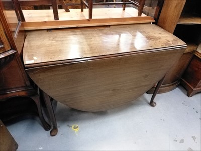 Lot 889 - Antique mahogany oval drop leaf dining table on round tapered legs with pad feet