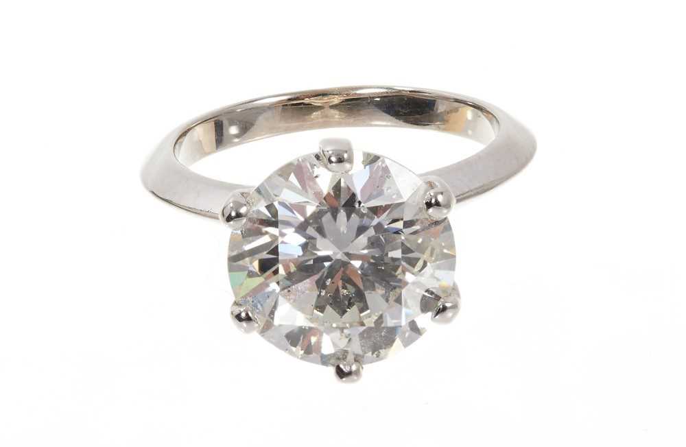 Lot 609 - Fine diamond single stone ring with a round brilliant cut diamond weighing 5.03 carats, accompanied by a Diamond Report by Gemmological Certification Services stating the colour grade K, clarity I1...