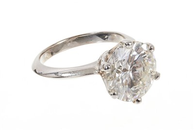 Lot 609 - Fine diamond single stone ring with a round brilliant cut diamond weighing 5.03 carats, accompanied by a Diamond Report by Gemmological Certification Services stating the colour grade K, clarity I1...